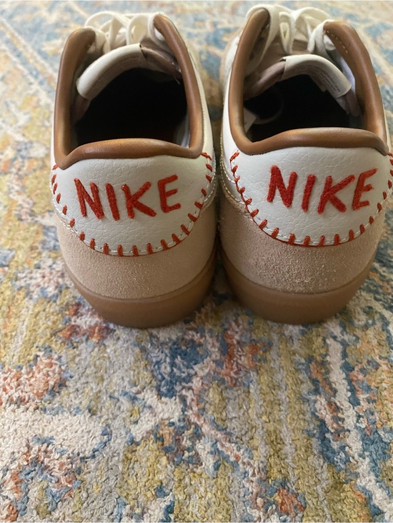 Nike Shoes - Nike Women’s White and Tan Casual Sneakers with Orange Accent
